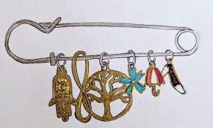 Symbolic charms hang from a safety pin